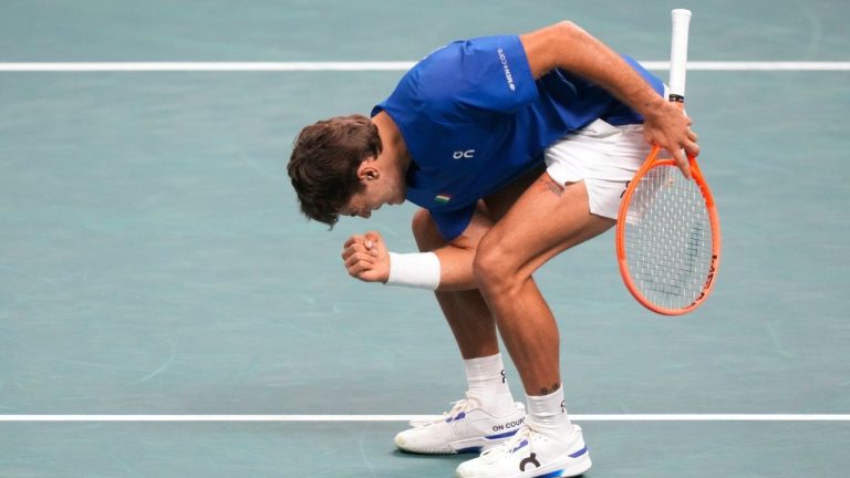 Italy's Flavio Cobolli celebrates after winning a point to Belgium's Zizou Bergs during a Davis Cup singles semifinal match between Italy and Belgium, in Bologna, Italy, Friday, Nov. 21, 2025. (Luca Bruno/AP)