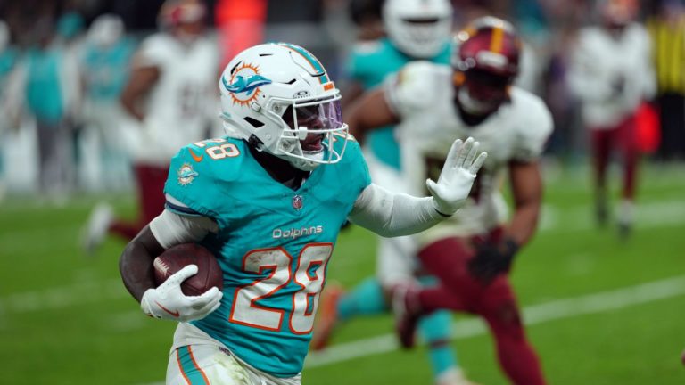 Miami Dolphins running back De'Von Achane (28) carries the ball against the Washington Commanders in the second half of an NFL football game in Madrid, Spain, on Sunday, Nov. 16, 2025. (Dave Shopland/AP Content Services for the NFL)