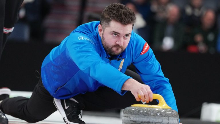 Skip Matt Dunstone delivers a stone during Canadian Olympic curling trials semifinal action against Team McEwen in Halifax on Thursday, November 27, 2025. (Darren Calabrese/THE CANADIAN PRESS)