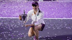 Elena Rybakina of Kazakhstan poses with the trophy after defeating Aryna Sabalenka of Belarus in the women's final singles match of the WTA finals in Riyadh, Saudi Arabia, Saturday, Nov. 8, 2025. (Fatima Shbair/AP)