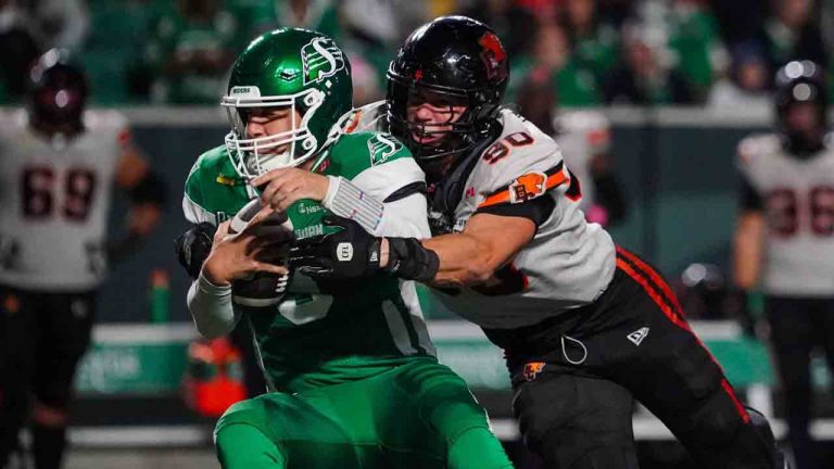 B.C. Lions defensive lineman Mathieu Betts (90) tackles Saskatchewan Roughriders quarterback Jake Maier (9) during the second half of CFL football action in Regina, on Saturday, October 25, 2025. (Heywood Yu/CP)