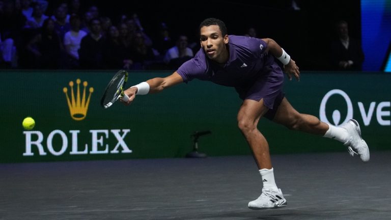 Canada's Felix Auger-Aliassime returns to Italy's Jannik Sinner during the final match of the Paris Masters tennis tournament in Paris, Sunday, Nov. 2, 2025. (Christophe Ena/AP)