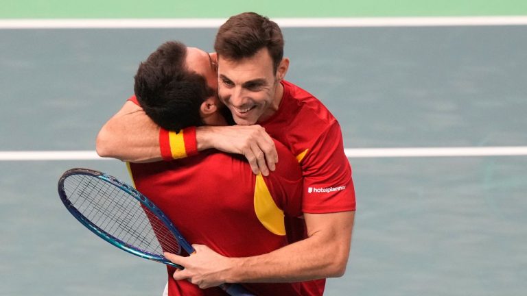 Spain's Marcel Granollers and his teammate Pedro Martinez celebrate as they play against Czechia's Tomas Machac and his teammate Jakub Mensik during a Davis Cup quarterfinal double tennis match in Bologna, Italy, Thursday, Nov. 20, 2025. (Luca Bruno/AP)
