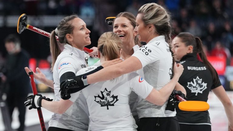 Team Homan celebrates its victory over Team Einarson to finish top of the group and earning a spot in the finals of the Canadian Olympic curling trials in Halifax, Wednesday, Nov. 26, 2025. (Darren Calabrese/THE CANADIAN PRESS)