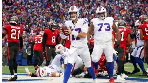Buffalo Bills quarterback Josh Allen (17) reacts after scoring a touchdown against the Tampa Bay Buccaneers during the first half of an NFL football game, Sunday, Nov. 16, 2025, in Orchard Park, N.Y. (Jeffrey T. Barnes/AP)