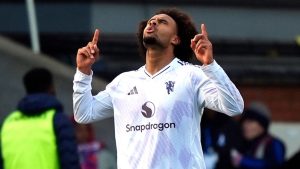 Manchester United's Joshua Zirkzee celebrates scoring during the English Premier League soccer match between Crystal Palace and Manchester United in London, Sunday Nov. 30, 2025. (Jordan Pettitt/PA via AP)