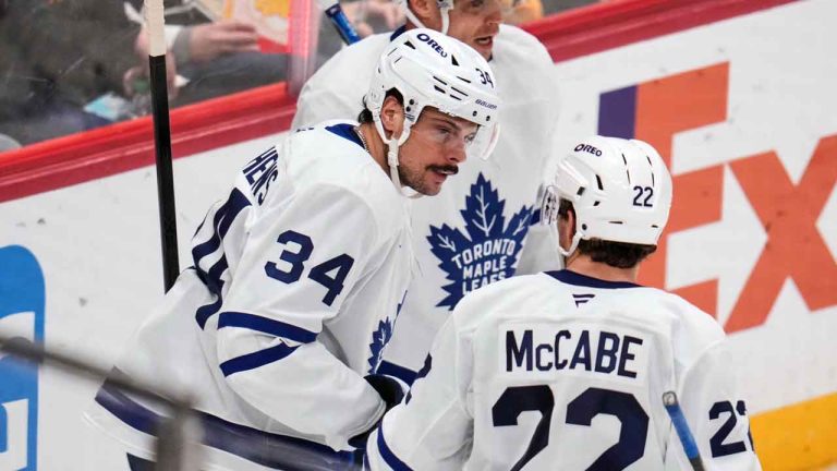 Toronto Maple Leafs' Auston Matthews (34) celebrates after his goal with Jake McCabe (22) during the third period of an NHL hockey game against the Pittsburgh Penguins. (Gene J. Puskar/AP)