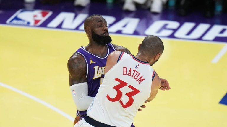 Los Angeles Clippers forward Nicolas Batum (33) is fouled by Los Angeles Lakers forward LeBron James during the first half of an NBA Cup basketball game Tuesday, Nov. 25, 2025, in Los Angeles. (Jae C. Hong/AP)