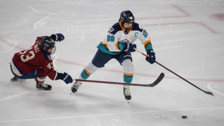 Montreal Victoire's Kristin O'Neill (43) defends against New York Sirens Micah Zandee-Hart (28) during second period PWHL hockey action in Laval, Que. Saturday February 15, 2025. (Peter McCabe/CP)