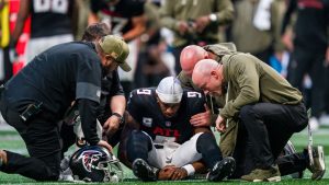 The Atlanta Falcons training staff tends to quarterback Michael Penix Jr. (9) during the second half of an NFL football game against the Carolina Panthers, Sunday, Nov. 16, 2025, in Atlanta. (Danny Karnik/AP)
