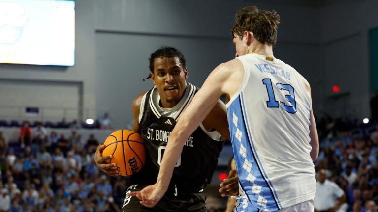 St. Bonaventure forward Frank Mitchell drives to the basket past North Carolina centre Henri Veesaar during the second half of an NCAA college basketball game, Tuesday, Nov. 25, 2025 in Ft. Myers, Fla. (Scott Audette/AP Photo)