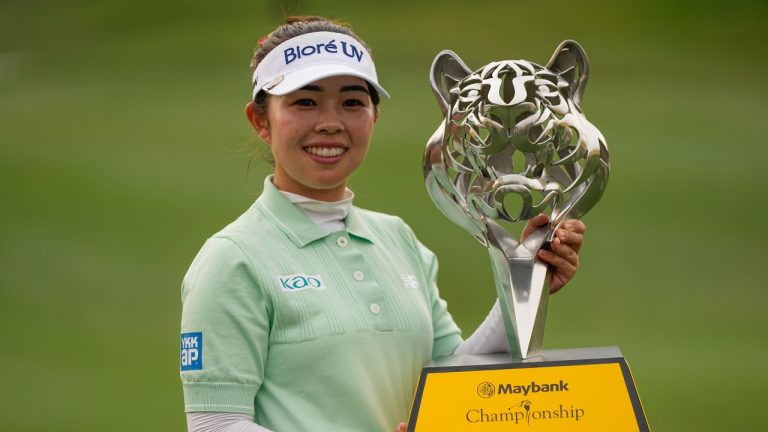Miyu Yamashita of Japan holds the winning trophy after winning the LPGA Tour's Maybank Championship at Kuala Lumpur Golf and Country club in Kuala Lumpur, Malaysia, Sunday, Nov. 2, 2025. (Kien Huo/AP)