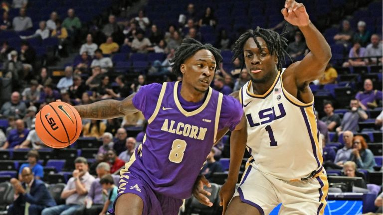 Alcorn State forward Tycen McDaniels (8) drives the ball around LSU forward Mike Nwoko (1) in the first half, Tuesday, November 18, 2025, at the LSU PMAC in Baton Rouge, La. (Hilary Scheinuk/The Advocate via AP)