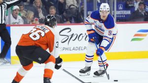 Edmonton Oilers' Vasily Podkolzin (92) tries to get a shot past Philadelphia Flyers' Emil Andrae during the first period of an NHL hockey game, Wednesday, Nov. 12, 2025, in Philadelphia. (Matt Rourke/AP)