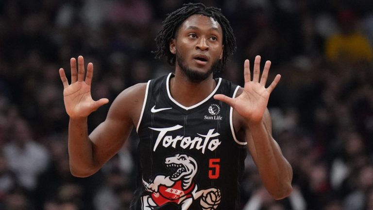 Toronto Raptors guard Immanuel Quickley (5) reacts after making a three point basket against the Charlotte Hornets during first half NBA basketball action in Toronto on Monday, November 17, 2025. (Nathan Denette/THE CANADIAN PRESS)