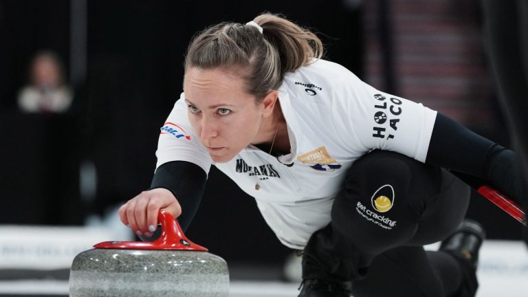 Skip Rachel Homan delivers a rock during Canadian Olympic curling trials finals action against Team Black in Halifax on Friday, November 28, 2025. (Darren Calabrese/CP)