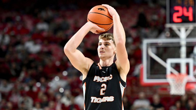 Pacific forward Elias Ralph (2) shoots against Arkansas during an NCAA college basketball game Monday, Nov. 18, 2024, in Fayetteville, Ark. (Michael Woods/AP Photo)