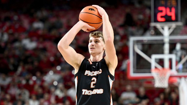 Pacific forward Elias Ralph (2) shoots against Arkansas during an NCAA college basketball game Monday, Nov. 18, 2024, in Fayetteville, Ark. (Michael Woods/AP Photo)