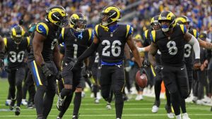 Los Angeles Rams safety Kamren Kinchens (26) celebrates an interception with teammates during the second half of an NFL football game against the Seattle Seahawks, Sunday, Nov. 16, 2025, in Inglewood, Calif. (Gregory Bull/AP)