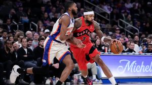 Toronto Raptors forward Brandon Ingram drives past New York Knicks guard Mikal Bridges (25) during the first half of an NBA game Sunday, Nov. 30, 2025, in New York. (Yuki Iwamura/AP)