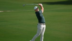 Rory McIlroy of Northern Ireland plays his second shot on the 1st hole during the first round of World Tour Golf Championship at Jumeirah Golf Estates, in Dubai, United Arab Emirates, Thursday, Nov. 13, 2025. (Altaf Qadri/AP)