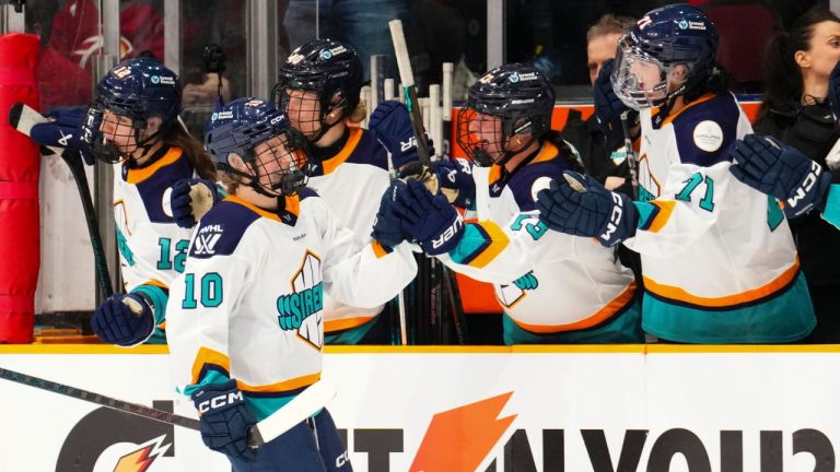 New York Sirens' Sarah Fillier (10) celebrates her goal with the bench while taking on the Ottawa Charge during the third period of a PWHL hockey game in Ottawa, Ontario, Tuesday, March 25, 2025. (The Canadian Press via AP)