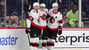 Ottawa Senators' Tim Stützle, centre, celebrates his game wining goal with Drake Batherson (19) and Thomas Chabot (72) during overtime in an NHL hockey game against the Philadelphia Flyers, Saturday, Nov. 8, 2025, in Philadelphia. (Derik Hamilton/AP Photo)