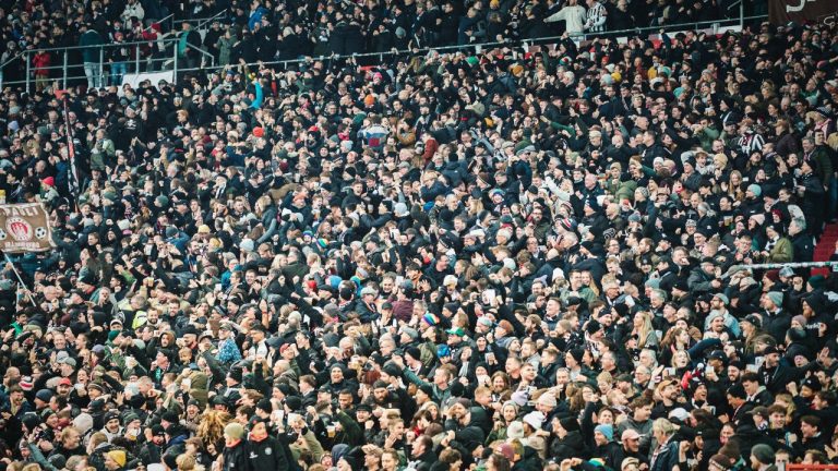 St. Pauli fans celebrate during a match against TSG Hoffenheim at Millerntor Stadion, on Oct. 28, 2025, in Hamburg, Germany. (BEAUTIFULxSPORTS/Tonhäuserx/via CP)