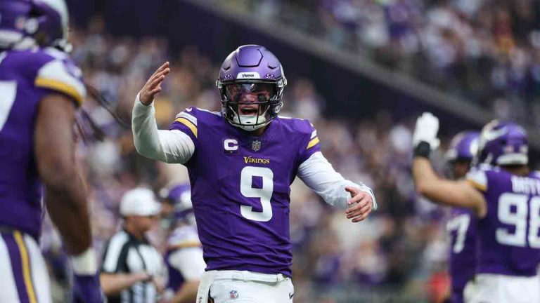 Minnesota Vikings quarterback J.J. McCarthy (9) reacts after running back Jordan Mason, foreground left, scored a touchdown during the first half of an NFL football game against the Washington Commanders, Sunday, Dec. 7, 2025, in Minneapolis. (Matt Krohn/AP)