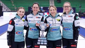 Switzerland’s Team Silvana Tirinzoni (middle right) holds the Canadian Open championship trophy with teammates Selina Witschonke, (far left) Carole Howald (middle left) and Alina Paetz (far right) after defeating Japan’s Team Satsuki Fujisawa at the HearingLife Canadian Open on Sunday Dec. 21, 2025, in Saskatoon, Sask. (Anil Mungal/TCG)