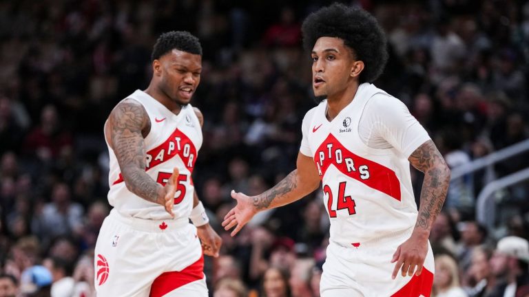 Toronto Raptors guard Chucky Hepburn (24) celebrates a basket against the Boston Celtics with guard Alijah Martin (55) during preseason NBA basketball action in Toronto Friday, October 10, 2025. (Thomas Skrlj/CP)