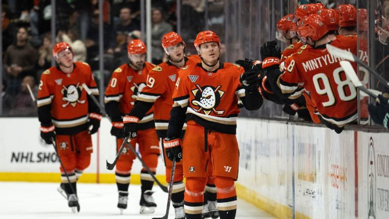 Anaheim Ducks center Mikael Granlund, center, celebrates with the bench after his goal during the second period of an NHL hockey game against the Seattle Kraken, Monday, Dec. 22, 2025, in Anaheim, Calif. (Kyusung Gong/AP)