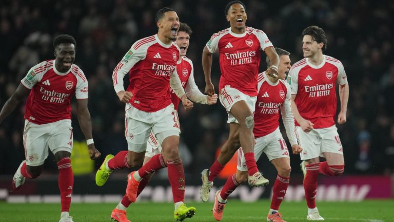 Arsenal players celebrate after winning in a penalty shootout the English Football League Cup quarter-final soccer match between Arsenal and Crystal Palace in London, Tuesday, Dec. 23, 2025. (Kin Cheung/AP)