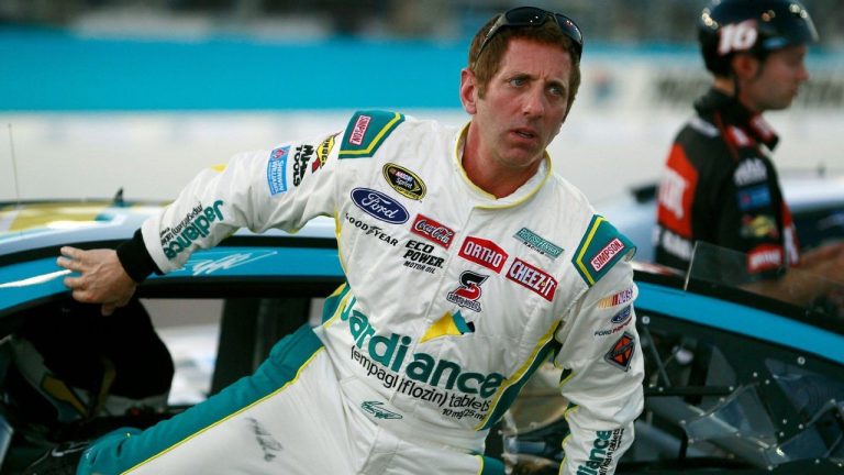 FILE - Greg Biffle climbs out of his car during qualifying for Sunday's NASCAR Sprint Cup series auto race at Phoenix International Raceway, Friday, Nov. 13, 2015 in Avondale, Ariz. (AP/Ralph Freso, File)