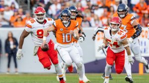Denver Broncos quarterback Bo Nix scrambles against the Kansas City Chiefs in an NFL game, Sunday, Nov. 16, 2025, in Denver. (AP/Jeff Lewis)