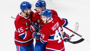 Montreal Canadiens' Zachary Bolduc celebrates his goal with teammates Alexandre Carrier and Lane Hutson during first period NHL action against the Chicago Blackhawks in Montreal on Thursday, Dec. 18, 2025. (THE CANADIAN PRESS/Christopher Katsarov)