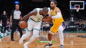 Boston Celtics guard Jaylen Brown, left, drives to the basket against Los Angeles Lakers guard Gabe Vincent, right, during the first half of an NBA game, Friday, Dec. 5, 2025, in Boston. (AP/Charles Krupa)