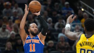 New York Knicks guard Jalen Brunson shoots in front of Indiana Pacers guard Bennedict Mathurin during the first half of an NBA game in Indianapolis, Thursday, Dec. 18, 2025. (AP/AJ Mast)