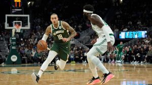 Milwaukee Bucks' Kyle Kuzma (18) drives to the basket against Boston Celtics' Neemias Queta during the first half of an NBA basketball game Thursday, Dec. 11, 2025, in Milwaukee. (Aaron Gash/AP)