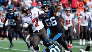 Tampa Bay Buccaneers running back Bucky Irving is tackled by Carolina Panthers safety Nick Scott during the first half of an NFL game, Sunday, Dec. 21, 2025, in Charlotte, N.C. (AP/Erik Verduzco)