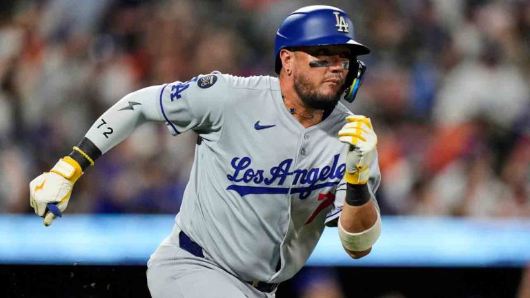 Los Angeles Dodgers' Miguel Rojas advances toward first base after hitting a double during the third inning of a baseball game against the Baltimore Orioles, Saturday, Sept. 6, 2025, in Baltimore. (Stephanie Scarbrough/AP)