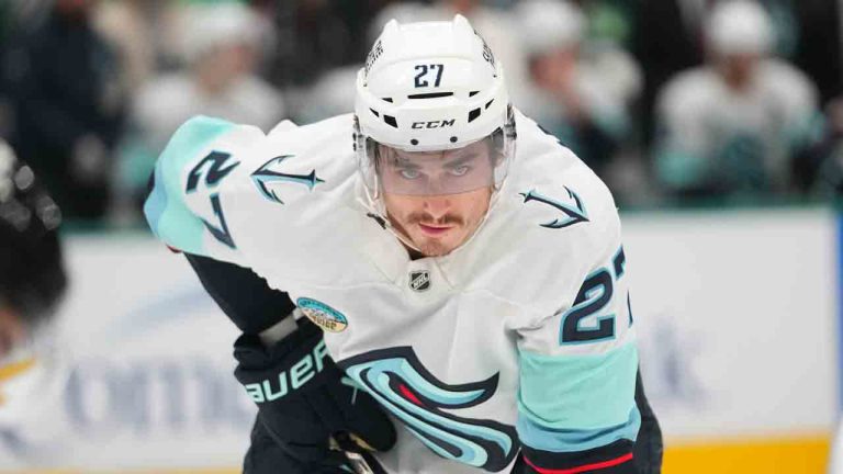 Seattle Kraken left wing Mason Marchment (27) waits for the puck drop during the second period of an NHL hockey game between the Dallas Stars and the Seattle Kraken Sunday, Nov. 9, 2025, in Dallas. (Julio Cortez/AP)