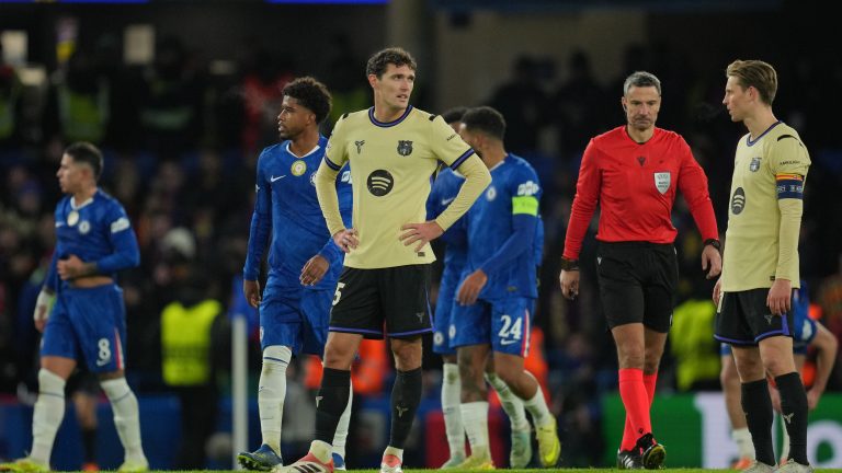 Barcelona's Andreas Christensen with his hands on his hip after Chelsea scored its third goal during the Champions League opening phase soccer match between Chelsea and Barcelona in London, Tuesday, Nov. 25, 2025. (Kin Cheung/AP)