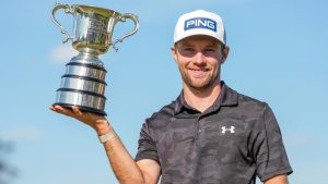 Denmark's Rasmus Neergaard-Petersen holds the Stonehaven Cup after winning the Australian Open golf tournament in Melbourne, Australia, Sunday, Dec. 7, 2025. (Asanka Brendon Ratnayake/AP)