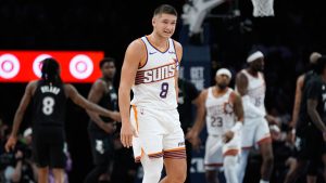 Phoenix Suns guard Grayson Allen walks across the court after missing a shot during the first half of an NBA game against the Minnesota Timberwolves, Monday, Dec. 8, 2025, in Minneapolis. (Abbie Parr/AP)