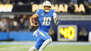 Los Angeles Chargers quarterback Justin Herbert (10) runs during the second half of an NFL football game against the Philadelphia Eagles, Monday, Dec. 8, 2025, in Inglewood, Calif. (Caroline Brehman/AP)
