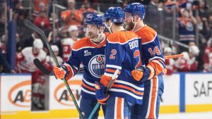 Edmonton Oilers' Zach Hyman, Evan Bouchard and Mattias Ekholm celebrate a goal against the Detroit Red Wings during second period NHL action, in Edmonton on Thursday, December 11, 2025. (Jason Franson/CP)