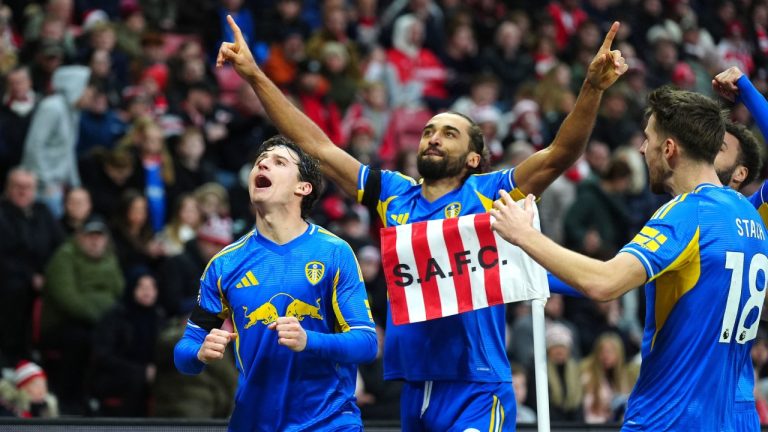 Leeds United's Dominic Calvert-Lewin, center, celebrates scoring their side's first goal of the game during the English Premier League soccer match in Sunderland, England, Sunday, Dec. 28, 2025. (Owen Humphreys/PA via AP)