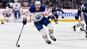 Edmonton Oilers' Connor McDavid (97) carries the puck towards the Winnipeg Jets net during the first period of their NHL hockey game in Winnipeg, Monday December 29, 2025. (Fred Greenslade/AP)