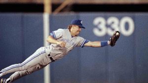 Toronto Blue Jays third baseman Jeff Kent dives to catch a line-drive fly ball hit by Texas Rangers batter Dickie Thon to end the third inning at night, Wednesday, June 24, 1992 in Arlington, Texas. (Bill Janscha/AP)